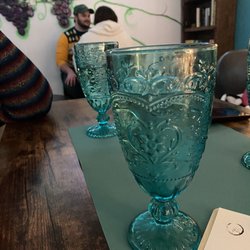 Grand Spirits Bottle Co. - Water glasses and restaurant interior