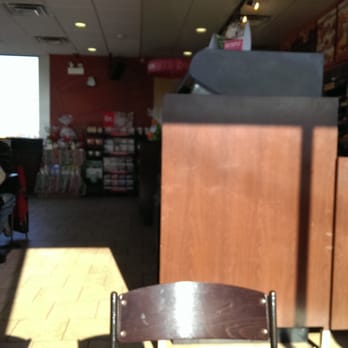 Dunkin' -  a person sitting at a table in a restaurant - Donuts Near Me - Midlothian, Illinois