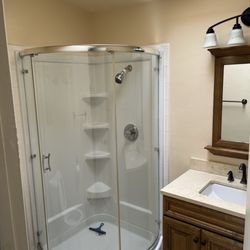 JLK Cleaning - Shower and vanity in bathroom, what a difference!