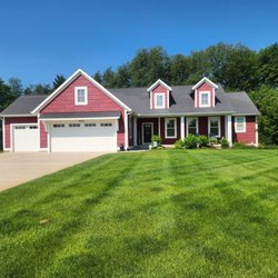 BlueGrass Lawns - Lawn Care & Pest Control that creates this healthy, green, and thriving lawn in Belding, MI!