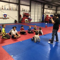 Hero Martial Arts - Master Nick teaching the kids gun safety and how to shoot the different nerf guns