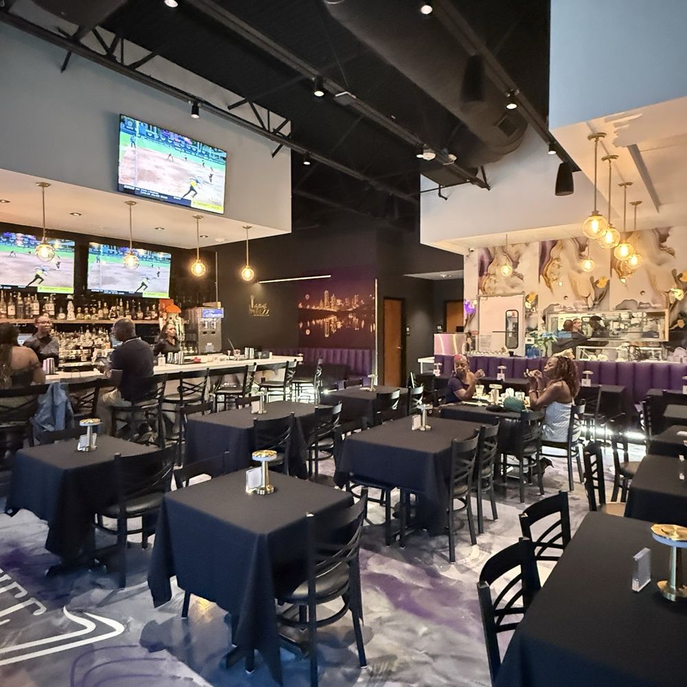 This Is Pheezz - Tables and dining area - Caribbean Near Me - Addison, Texas