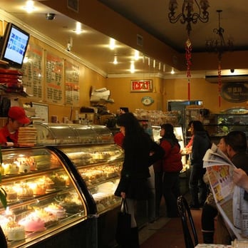Sheng Mary Bakery - employees wrapping up freshly made pineapple cakes - Bakeries Near Me - Flushing, New York Sheng Mary Bakery - employees wrapping up freshly made pineapple cakes - Bakeries Near Me - Flushing, New York
