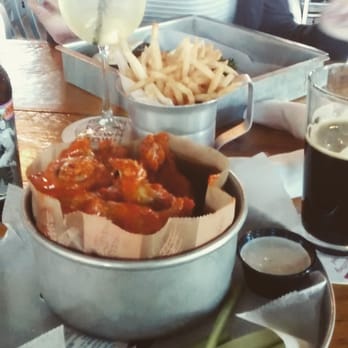 River Road Tavern - "Stupid wings" with fries. My friend got a burger and sangria. - American Near Me - Bedford, New Hampshire River Road Tavern - "Stupid wings" with fries. My friend got a burger and sangria. - American Near Me - Bedford, New Hampshire