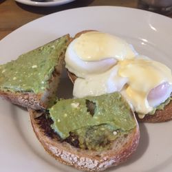 The Flour Pot Cafe - Aussie breaky: sourdough with a light spread of vegemite and avo smash topped with poached eggs