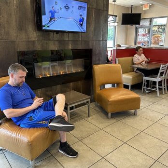 Wendy's - a man sitting in a chair in front of a television - Burgers Near Me - Huntington, West Virginia Wendy's - a man sitting in a chair in front of a television - Burgers Near Me - Huntington, West Virginia