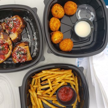 Unscripted Durham - Clockwise: bruschetta, potato croquettes with bechamel sauce and garlic fries - Hotels Near Me - Durham, North Carolina Unscripted Durham - Clockwise: bruschetta, potato croquettes with bechamel sauce and garlic fries - Hotels Near Me - Durham, North Carolina