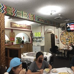 people eating at a restaurant people eating at a restaurant