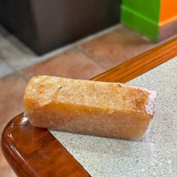 Lena's Roti & Doubles - Cassava Pone (~$3 CAD) - Caribbean Near Me - Mississauga, Ontario Lena's Roti & Doubles - Cassava Pone (~$3 CAD) - Caribbean Near Me - Mississauga, Ontario