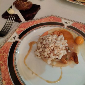 Schwa - Pig face fried and coated in chicharrones with bacon dressing, gooseberries, dried and not cherry tomatoes, and a pretzel with bacon butter - New American Near Me - Chicago, Illinois