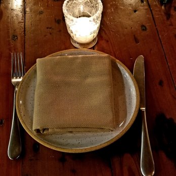 Manuela - Dinnerware with small candle at each table. - New American Near Me - Los Angeles, California Manuela - Dinnerware with small candle at each table. - New American Near Me - Los Angeles, California