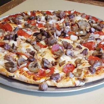 Geno's Pizza  - a pizza on a pan - Pizza Near Me - Preston, Iowa