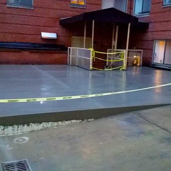 Foundation Station - a concrete slab with a yellow caution tape on it - General Contractors Near Me - Jeannette, Pennsylvania