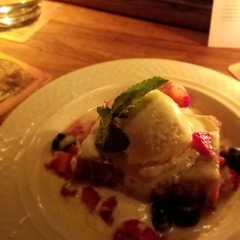 The Dead Rabbit - Bourbon pecan bread pudding.  Must get - Cocktail Bars Near Me - New York, New York