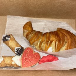 a croissant and a heart shaped cookie