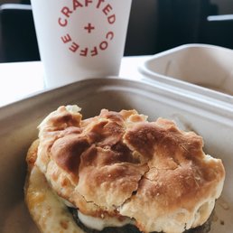Bfast Sandwich: sausage, egg, biscuit. Was good! Hot Med hazelnut chocolate latte with soy.