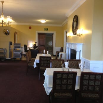 Waterman Manor - dining room with fireplace and dining table - Cafeteria Near Me - Burlington, Vermont Waterman Manor - dining room with fireplace and dining table - Cafeteria Near Me - Burlington, Vermont
