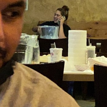 The Crab Shack - An employee on her phone during working hours not attending customers - Cajun/Creole Near Me - Gardena, California