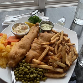Our Family Traditions - Fish and chips. Batter was a little soggy but the veggies were a nice add on and portion was really good. - Seafood Near Me - Tignish, Prince Edward Island