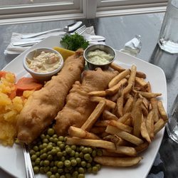 Our Family Traditions - Fish and chips. Batter was a little soggy but the veggies were a nice add on and portion was really good.