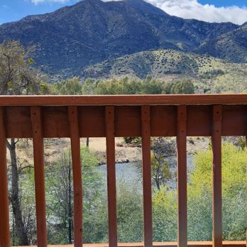 Whispering Pines Lodge - Beautiful view off the balcony and patio table and chairs. - Hotels Near Me - Kernville, California