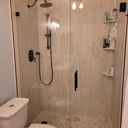 New installed frameless glass and hardware- dark oiled bronze. New installed frameless glass and hardware- dark oiled bronze.