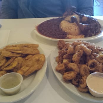 El Pollo Inka Peru - Half a chicken combo with beans and yellow rice, fried plantains and calamari. - Peruvian Near Me - Jackson Heights, New York El Pollo Inka Peru - Half a chicken combo with beans and yellow rice, fried plantains and calamari. - Peruvian Near Me - Jackson Heights, New York