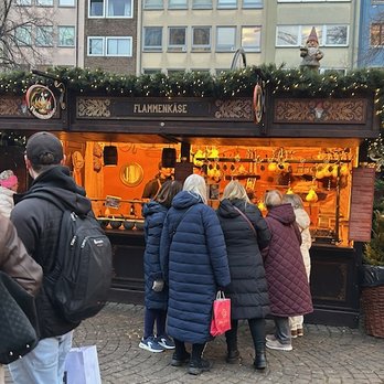 Weihnachtsmarkt Am Heumarkt - The flaming cheese booth, so good. - Christmas Markets Near Me - Cologne, NW