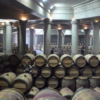 Chateau Lafite Rothschild - Cellar workers in the Signia Salon.  The circular chai was designed by Ricardo Bofill - Wineries Near Me - Pauillac, 33