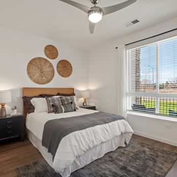 Fieldhouse - Bedroom with a ceiling fan and a window - Apartments Near Me - Thornton, Colorado Fieldhouse - Bedroom with a ceiling fan and a window - Apartments Near Me - Thornton, Colorado