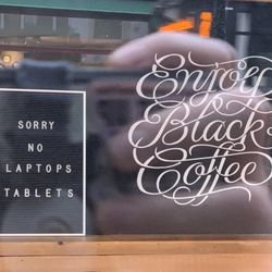 Chummy Coffee - Sign that says "Sorry No Laptops Tablets"