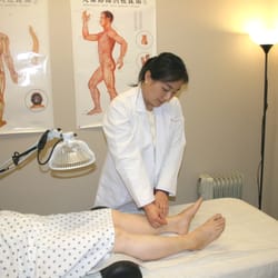 Yin's Acupuncture, Massage & Chinese Medicine Center - Angie Y in an acupuncture treatment session