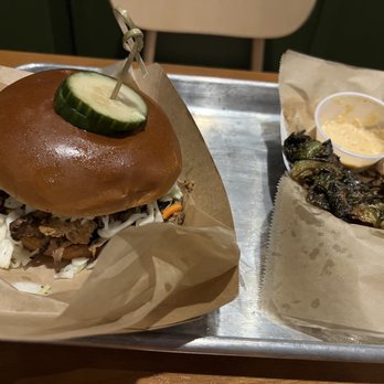 Old North State Food Hall - Pulled pork sandwich and half eaten fried Brussels sprout - Food Court Near Me - Selma, North Carolina Old North State Food Hall - Pulled pork sandwich and half eaten fried Brussels sprout - Food Court Near Me - Selma, North Carolina
