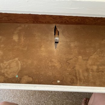 Borba Property Group - Dresser inside has wet spots and hole - Property Management Near Me - Long Beach, California Borba Property Group - Dresser inside has wet spots and hole - Property Management Near Me - Long Beach, California
