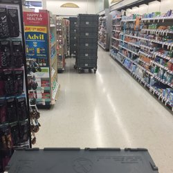Walgreens - Stacks of grey totes at the end of every aisle