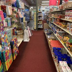 Nayco Family Stores - Party goods: paper bags, ribbons, and non-perishable food items. Drink cooler across the way.