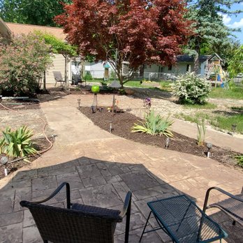 SimTech Outdoor Solutions - View from round patio to house. - Snow Removal Near Me - Dewitt, Michigan