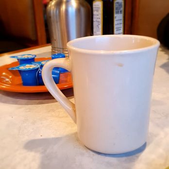 Julianna's Restaurant - a cup of coffee on a table - New American Near Me - Kalamazoo, Michigan Julianna's Restaurant - a cup of coffee on a table - New American Near Me - Kalamazoo, Michigan