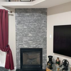 Natural Stone Fireplace Facade; stacked marble tile