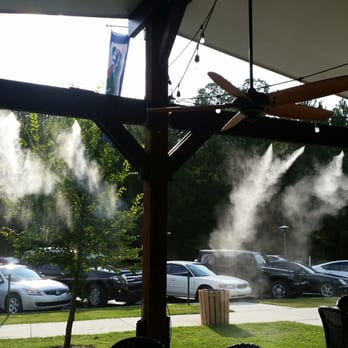 One Love Cafe - Cooling water mists, ceiling fans, and covered shade work to keep guests comfortable from the central Florida heat. - Cafes Near Me - Gainesville, Florida