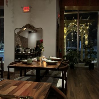 BarNaan - a wooden table and chairs in a restaurant - Indian Near Me - Brookfield, Connecticut BarNaan - a wooden table and chairs in a restaurant - Indian Near Me - Brookfield, Connecticut