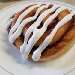 Cartoon Cafe - Our Classic Cinnamon Roll with Buttercream icing!