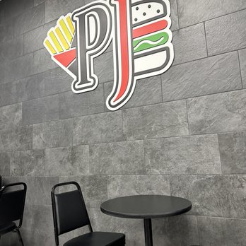 Peppajak - a table and chairs in a restaurant - Seafood Near Me - Riverview, Florida