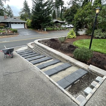 Image Landscape & Irrigation - Anchoring stone slabs for the steps. - Landscaping Near Me - Tacoma, Washington