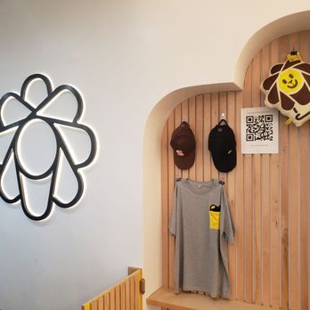 Sunright Tea Studio - Koreatown - a coat rack with a t - shirt hanging on it - Bubble Tea Near Me - Los Angeles, California