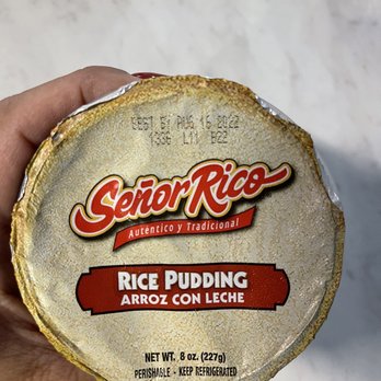 Walmart Supercenter - a person holding a container of rice pudding - Grocery Near Me - San Antonio, Texas