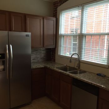 Kwik Kitchens - a kitchen with stainless steel appliances - General Contractors Near Me - Columbus, Ohio