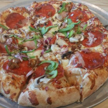 Pinthouse Pizza - The Works "Red sauce, cheese blend, pepperoni, Canadian bacon,house crumbled sausage, green peppers, garlic, mushrooms, and red onions" - Pizza Near Me - Austin, Texas