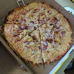 Asiago thin crust pizza, bacon onion and pineapple. Asiago thin crust pizza, bacon onion and pineapple.