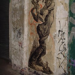Old Street Graffiti - Coronet Street: another piece of poster/stick up art on what was the Dragon's Den wall